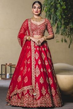 a woman in a red bridal gown