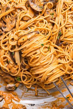 pasta with mushrooms and sauce in a pan