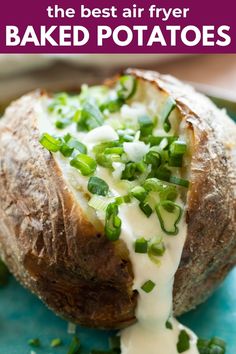 the best air fryer baked potatoes with green onions and sour cream sauce on top