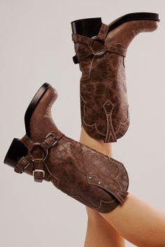 These tough leather boots infuse a classic motorcycle style with Western charm, featuring chunky harness and buckle details and instantly recognizable cowboy embroidery for a pair ready for a rugged rodeo. Fit: Tall style, pull-on design Features: Leather uppers, square toe, pull straps, dipped toplines, Western-inspired stitching, harness and buckle detailing, chunky block heel Designed by Understated Leather, created by Jeffrey Campbell, and exclusive to FP, these one-of-a-kind boots are an el Cowboy Embroidery, Confident Outfit, Freebird Boots, Upcoming Fashion Trends, Classic Motorcycle, Leather Western Boots, Shoe Ideas, Cowboy Boots Women, Motorcycle Style