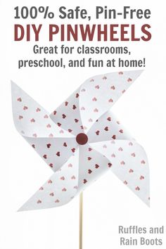 a pinwheel with hearts on it and the words, 100 % safe pin - free diy pinwheels great for classrooms, preschool, and fun at home