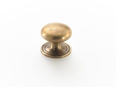 an antique brass door knob on a white background