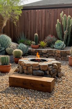 a fire pit surrounded by cacti and succulents