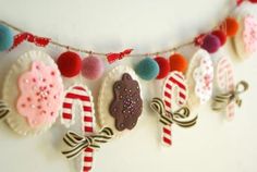 there are many candy decorations hanging on the wall