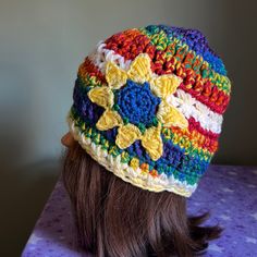 Crochet Handmade Flower Beanie Medium Acrylic Yarn Clean Never Worn New. Warmest Winter Beanie Wash Suggestion In Tied Pantyhose Sock Or Cloth Laundry Bag To Prevent Piling Fuzz And Maintain Form. Moveable Sunflower Wherever You Want It. Rainbow Colors With Yellow/White Stars Band And Brim And Yellow Sunflower. American Made Yellow Knitted Crochet Hat For Spring, Yellow Yarn Crochet Hat, Yellow Bohemian Crochet Hat For Spring, Handmade Yellow Crochet Hat For Spring, Yellow Crochet Hat For Spring, Hand Knitted Yellow Crochet Hat, Cute Multicolor Crochet Hat One Size, Casual Yellow Crochet Hat Hand Knitted, Yellow Bohemian Yarn Hat