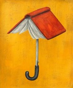 an umbrella shaped like a book with a book on it's head attached to the handle