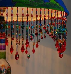 a lamp that has some beads hanging from it