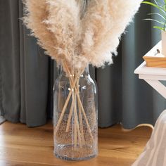 some white flowers in a glass vase on a table