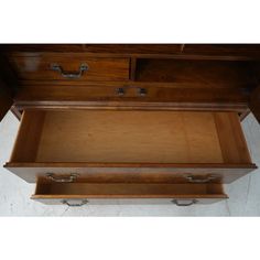 an old wooden desk with two drawers