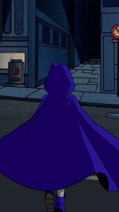 a person in a purple cloak walking down the street