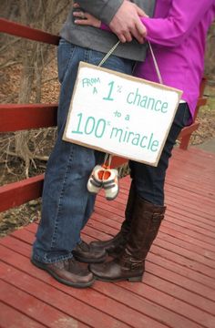 a man and woman are standing on a bridge holding a sign that says, from 1 to chance to a 100 - minute marriage