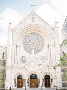 an old church with a large stained glass window