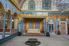 an ornately decorated room with gold and blue walls