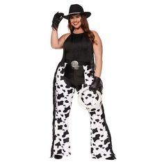 a woman in a cow costume is posing for the camera