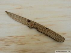 a wooden knife sitting on top of a table