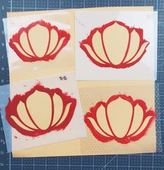 three pieces of paper that have been cut out to look like flower petals with red paint on them