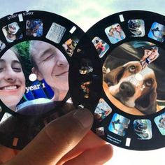 someone holding up two circular pictures with dogs on them