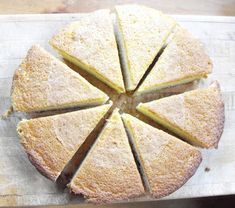 a cake that has been cut into eight pieces and is sitting on a cutting board