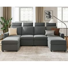 a living room with a gray sectional couch