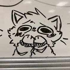 a drawing of a cat on the side of a car