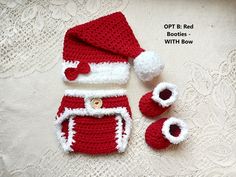 a crocheted santa hat, booties and mittens