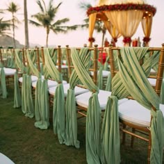 rows of chairs with green sashes on them