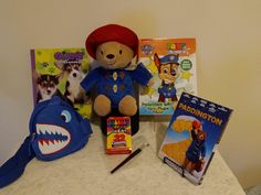 The Exciting Life of "Mr. Paddington Stuff Animal Doll" Which Includes Fun Accessories,  Mini shoulder bag of a shark and a DVD of Paddington. Also PAW Patrol Paint book with paint brush all you need to add is a little water. Plus a Giant coloring and activity book called Doggy Days  with a large box or crayons 32 colors.  Fun activities for the Weekend ages 4 and older Paint Book, Fun Accessories, Henderson Nv, Painted Books, Water Painting, Mini Shoulder Bag, Activity Book, Paint Brush, Paw Patrol