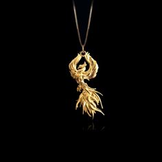 Embrace the transformative power of the legendary Phoenix pendant. Crafted with intricate detail, this gold masterpiece symbolizes rebirth and resilience. Feel the fiery spirit of Phoenix, representing strength and renewal. PENDANT INFORMATIONThis pendant is made of real, solid gold.• Made in USA• Material: 14k or 18k solid gold• Finish: polished• Height: 1.5" (38,5 mm) x Width: 0.85" (21,5 mm)• Pendant weight: approx. 6 grams (14k)• Bail: fits up to 4 mm chains• Solid back, not hollow• A certif Phoenix Accessories, Luxury Mythological Pendant Necklaces, Yellow Gold Dragon Design Pendant Jewelry, Mythical Bird, Phoenix Necklace, Phoenix Pendant, Phoenix Design, Gold Dragon, Gold Medallion