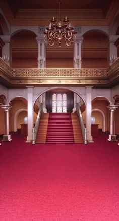 an empty hall with red carpet and chandelier