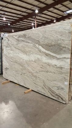 white marble is stacked up in a warehouse