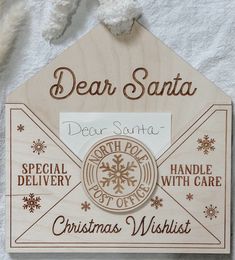 a wooden sign with the words dear santa written on it