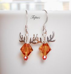 the earrings are made with swarong crystal beads and deer antlers on them