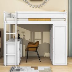 there is a white loft bed with a desk underneath it