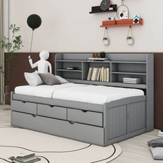 a bedroom with a bed, bookshelf and an alarm clock on the wall