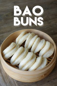 a wooden bowl filled with sliced bananas on top of a table