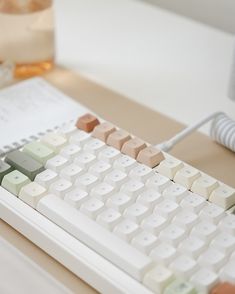 a computer keyboard sitting on top of a desk