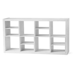 a white shelf with several shelves on each side