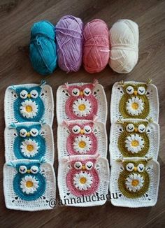 crochet owl afghans and balls of yarn laid out on a wooden floor