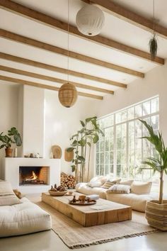 a living room filled with furniture and a fire place in the middle of the room