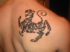 a man with a tattoo on his back