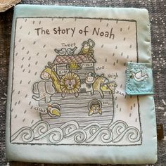 the story of noah is embroidered onto a small piece of cloth with an animal on it