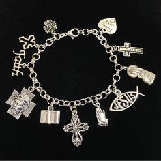 New. This Bracelet Makes A Perfect Gift Has 11 Religious Christian Themed Charms Stainless Steel Bracelet Has A Lobster Clasp Closure Measures Approx 8” Bracelet And Charms Are Silver Tone Alloy And Steel. Charms Include Jesus Loves You, Cross, Faith, Jesus Face On Cross, Bible, Cross, Praying Hands, Jesus Fish, Mother Mary Holding Baby Jesus, Trust God Cross, I Love God Heart God Bracelet, God Cross, Bible Cross, I Love God, Graduation 2024, God's Heart, Jesus Face, Praying Hands, Friend Bracelets