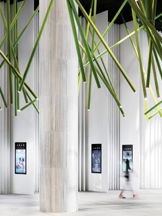 the interior of an art gallery with tall columns