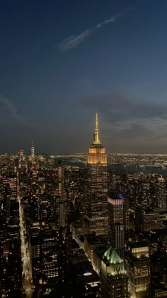 an aerial view of new york city at night from the top of the empire building