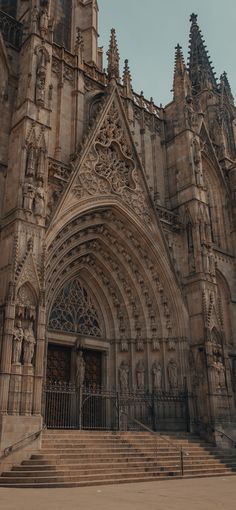 an old cathedral with stairs leading up to it