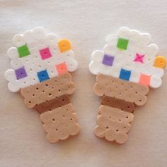 two cookies shaped like cartoon characters on a white surface