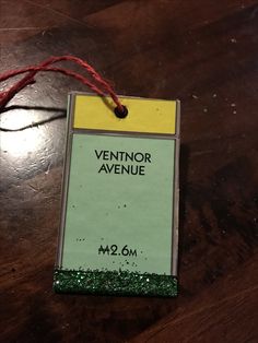 a sign that is on top of a wooden table next to a red string with the name vendor avenue