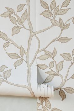 the wall paper has leaves on it