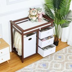 a toy crib with three bins and two stuffed animals