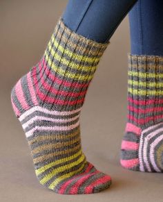 the legs of a woman wearing colorful socks